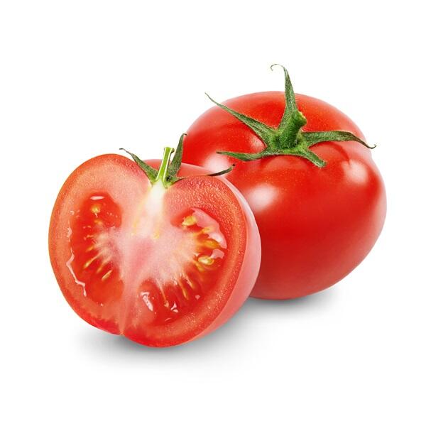 2 tomatoes one whole one sliced white background